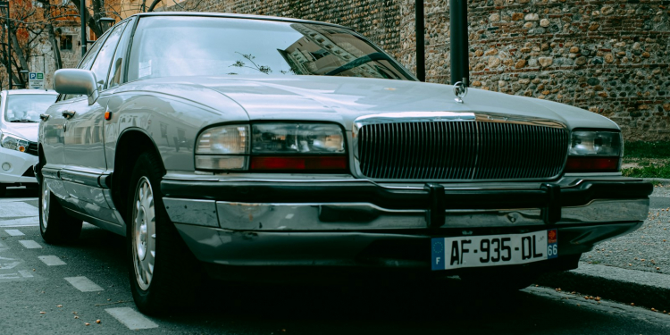 a silver car parked on the side of the road